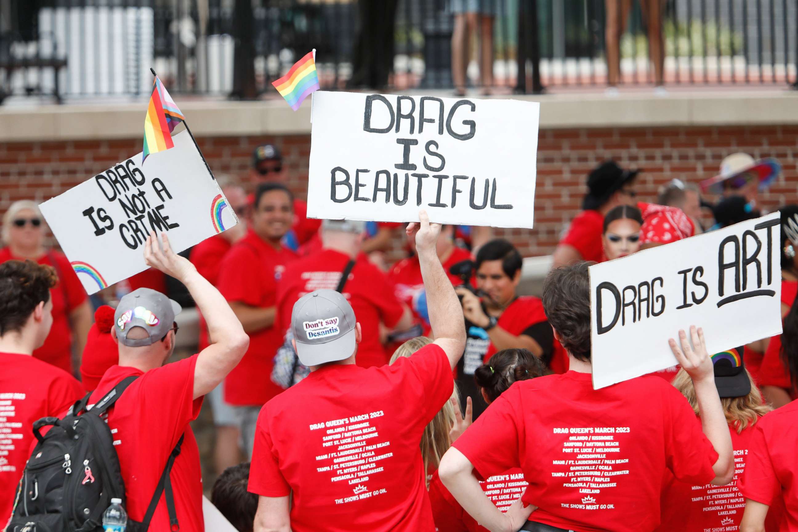 PHOTO: People display their signs during the Drag Queen's March at Cascades Park on April 25, 2023, in Tallahassee, Fla.