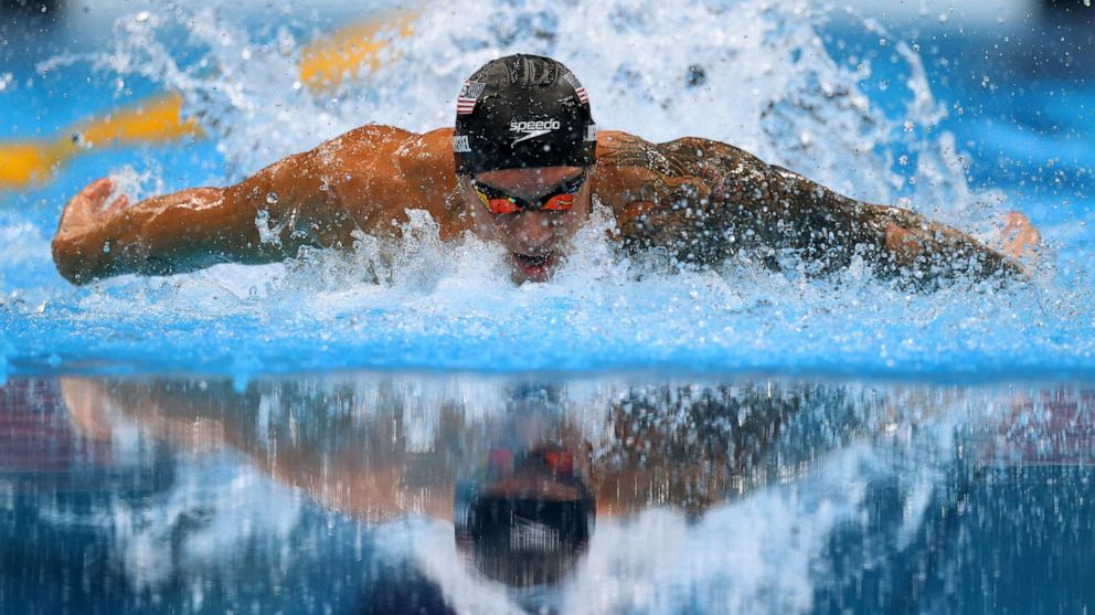 PHOTO: Caeleb Dressel of the United States swims in the men's 100m butterfly on July 31, 2021, in Tokyo, Japan.