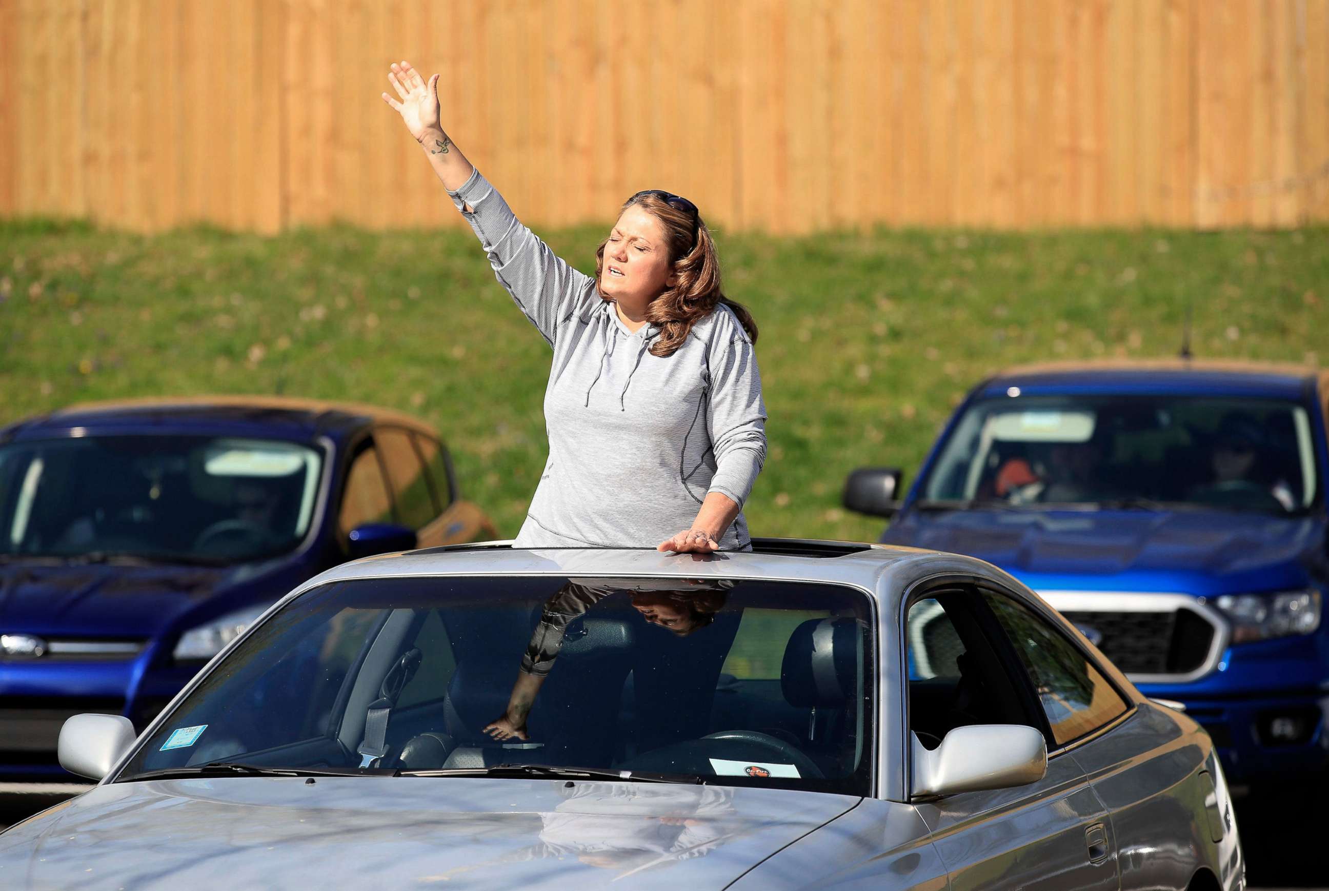 PHOTO: A worshiper listens to a song during the drive in service at On Fire Christian Church, on April 05, 2020, in Louisville, Kentucky.