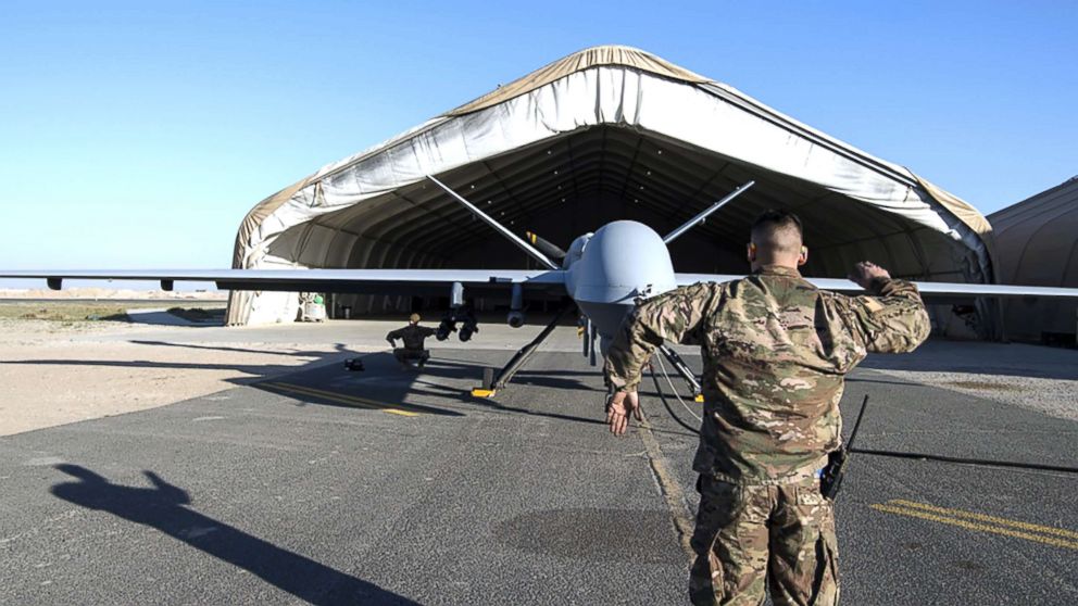 PHOTO: irman 1st Class Johnathan, 386th Expeditionary Aircraft Maintenance Squadron crew chief, and Airman 1st Class Brandon, 386th EAMXS avionics specialist, conduct flight control checks of a MQ-9 Reaper launch in Southwest Asia, Feb. 21, 2019.