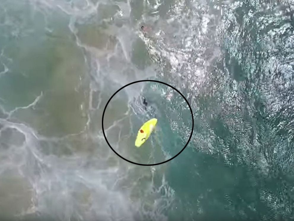 PHOTO:A drone deploys an inflatable life raft for two swimmers at Lennox Beach, north of Ballina, Australia.