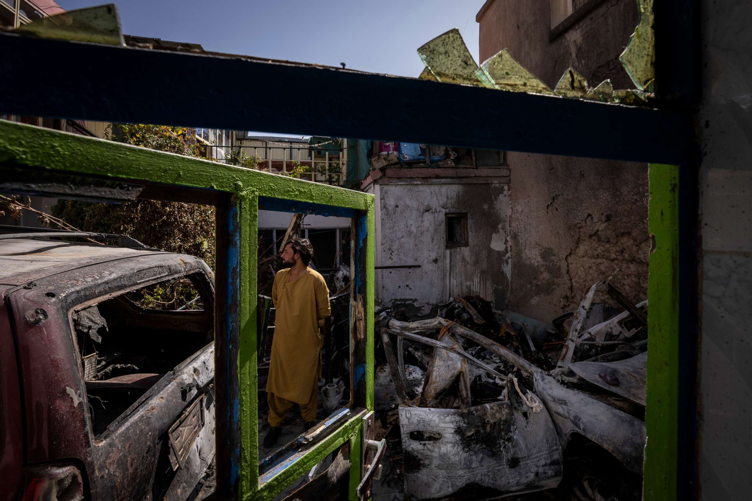 PHOTO: An Afghan inspects the damage of Ahmadi family house in Kabul, Afghanistan, Monday, Sept. 13, 2021.