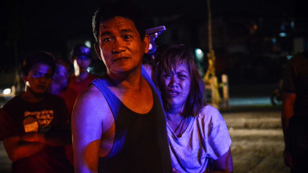 PHOTO: The parents of Irish Glorioso weep after learning their son was shot dead by unknown assailants in Navotas, north of Manila, Philippines, June 8, 2017. Drug-related killings continue as President Rodrigo Duterte marks his first year in power.