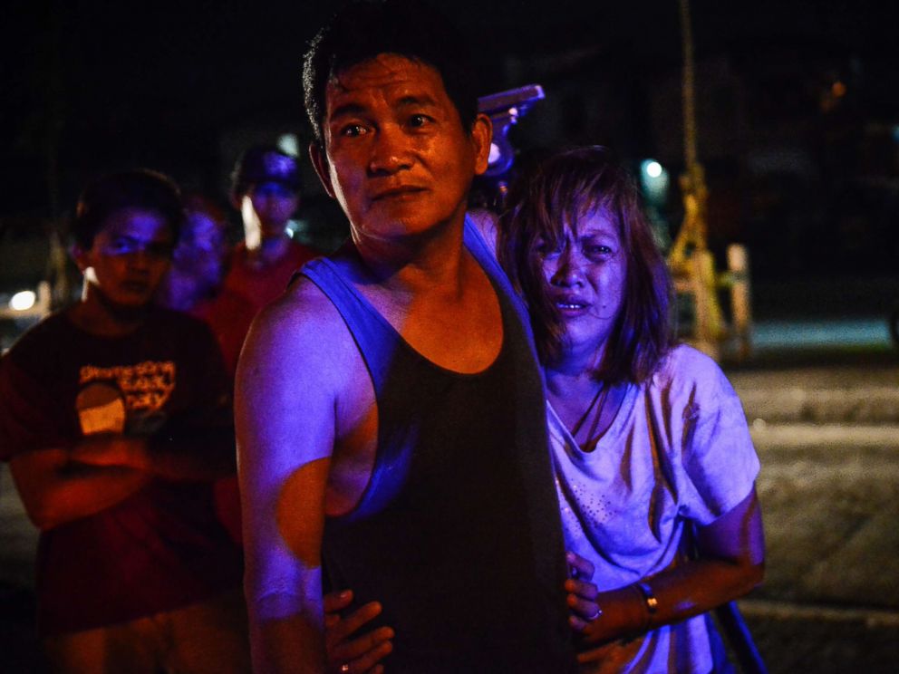 PHOTO: The parents of Irish Glorioso weep after learning their son was shot dead by unknown assailants in Navotas, north of Manila, Philippines, June 8, 2017. Drug-related killings continue as President Rodrigo Duterte marks his first year in power.