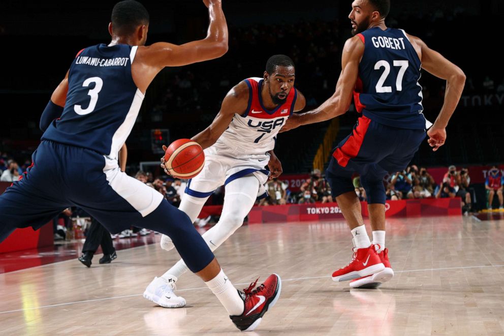 PHOTO: Kevin Durant of the United States drives in during the gold medal match against France on Aug. 7, 2021, in Saitama, Japan.