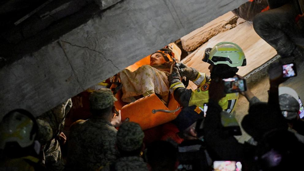PHOTO: Jhonquer Cerpas, 13, is rescued by the Mexican brigade, in rescue efforts after earthquakes hit the country, in La Guaira, Venezuela, June 27, 2026.