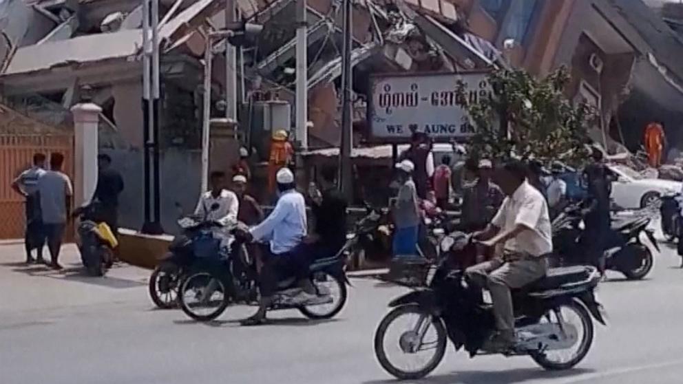 PHOTO: People gather near a collapsed building following an earthquake in Aungpan, Myanmar, Mar. 28, 2025.