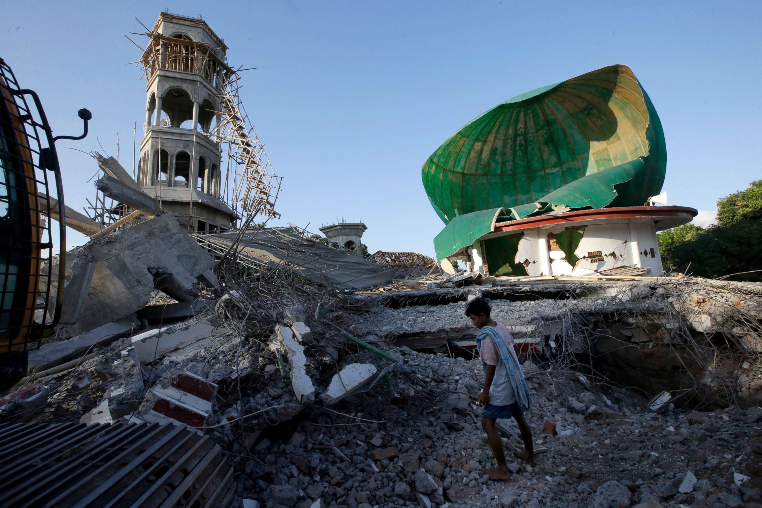 PHOTO: A resident inspects a mosque damaged by an earthquake in North Lombok, Indonesia, Aug. 7, 2018.