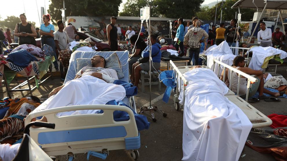 PHOTO: Patients lie outside a hospital evacuated after it was damaged in an earthquake in Catia La Mar, Venezuela, June 25, 2026. 