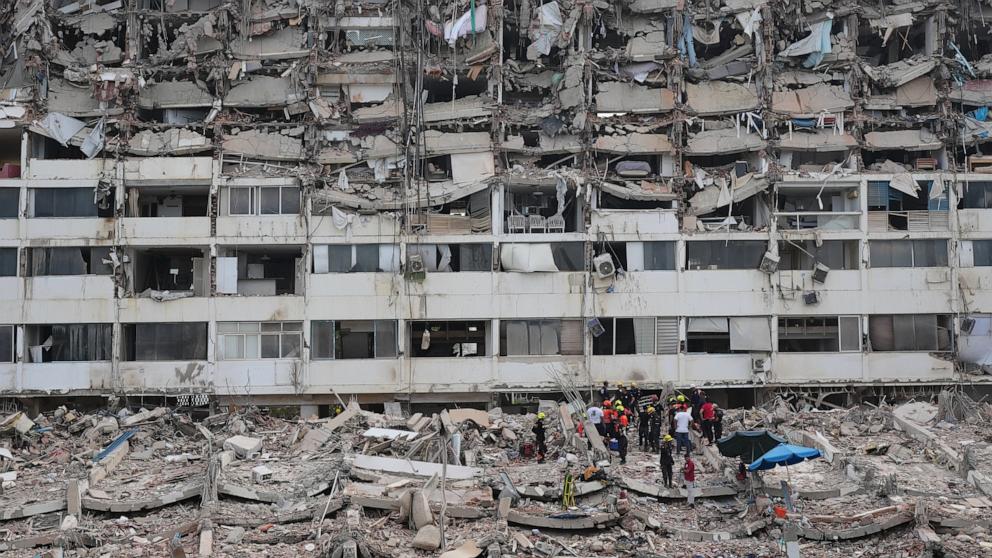 PHOTO: Rescue workers search through the rubble of a building that collapsed when earthquakes struck La Guaira, Venezuela, June 28, 2026. 
