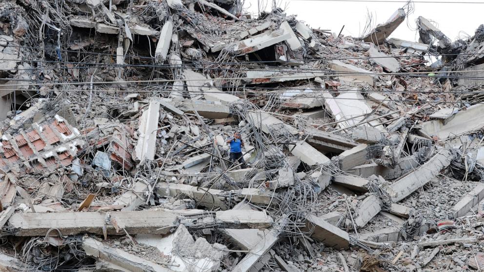 PHOTO: A man walks among the rubble of a building that collapsed in an earthquake in La Guaira, Venezuela, June 25, 2026.