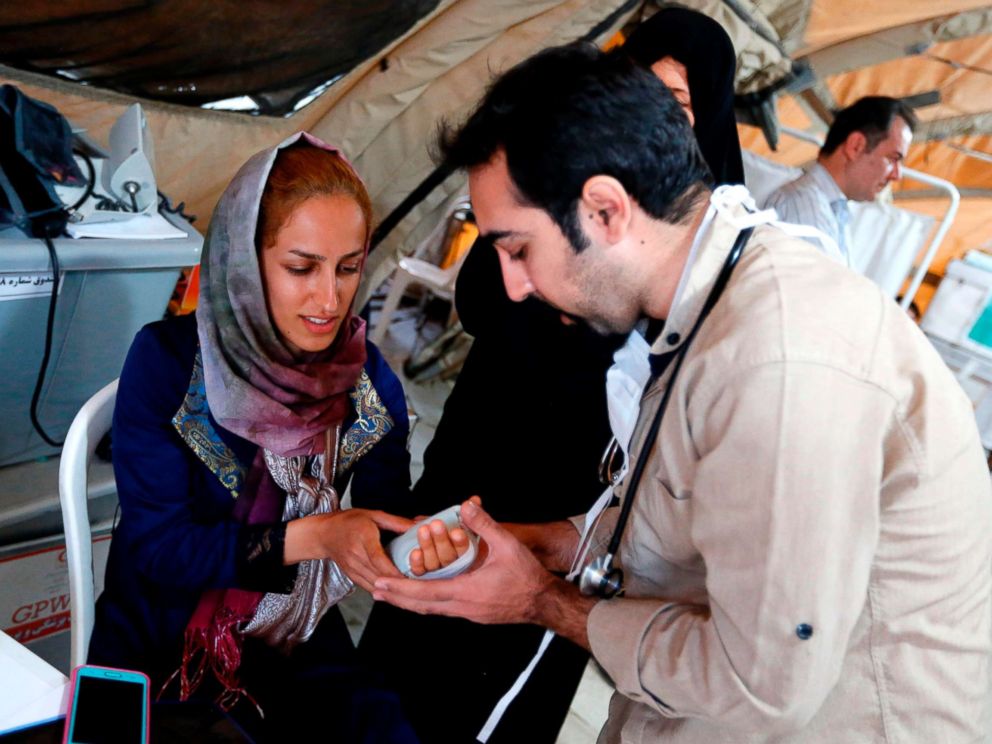 PHOTO: Medics attend to quake victims at a field hospital in the town of Sarpol-e Zahab in the western Kermanshah province near the border with Iraq on Nov. 14, 2017.