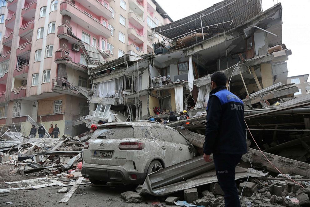 PHOTO: Rescuers search for survivors at a damaged building following an earthquake in Diyarbakir, Turkey, Feb. 6, 2023.