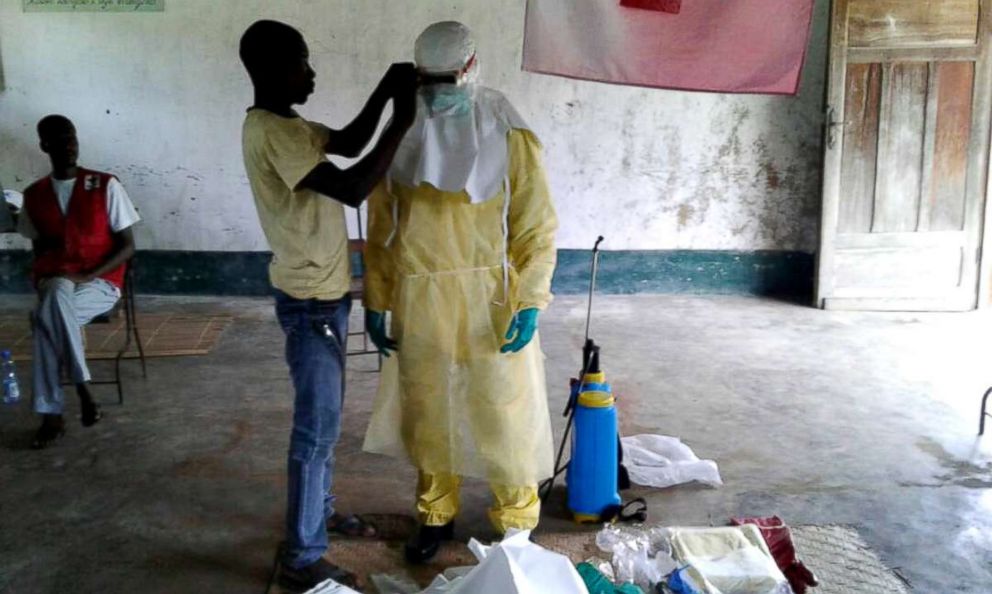 PHOTO: A handout photo from the International Federation of Red Cross and Red Crescent (IFRC) shows health workers in protective clothing in Bikoro, the epicenter of the latest Ebola outbreak, in The Democratic Republic Of The Congo on May 17, 2018.