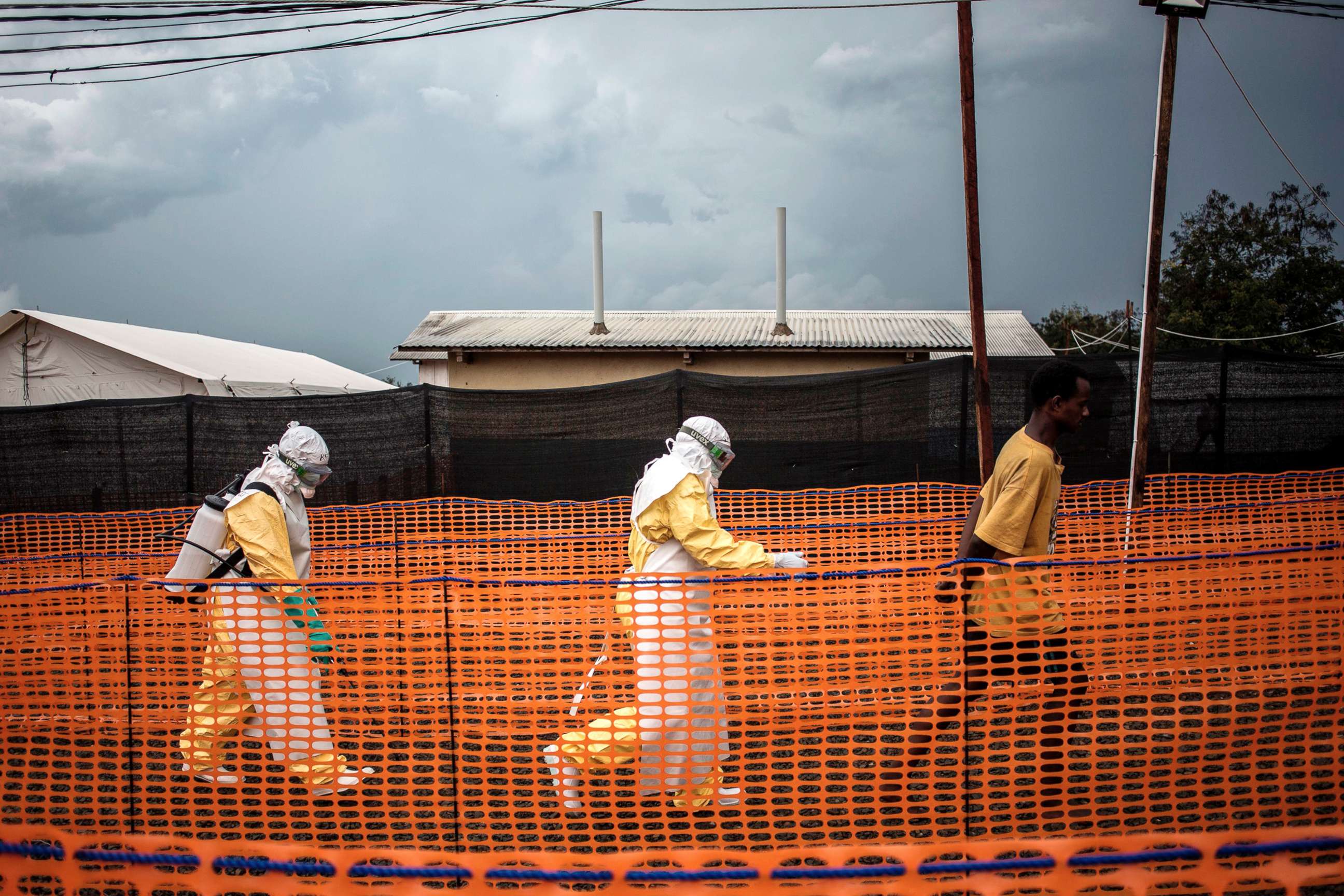 PHOTO: Health workers escort an unconfirmed Ebola patient at a newly build MSF (Doctors Without Borders) supported Ebola treatment centre in Bunia, Democratic Republic of the Congo, Nov. 7, 2018.
