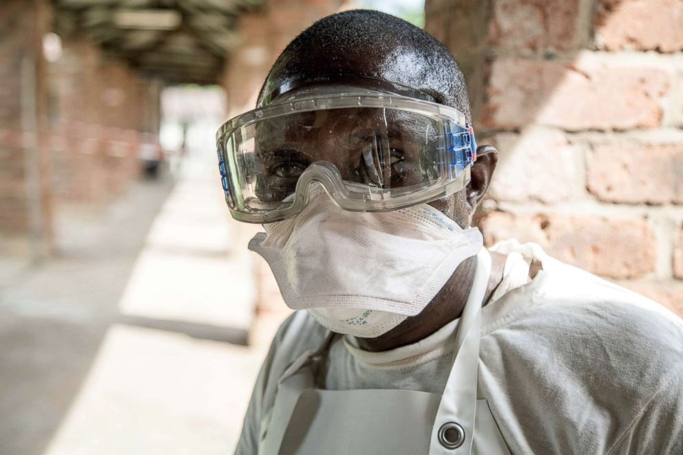 PHOTO: A health worker wears protective equipment as he looks on at Bikoro Hospital, the epicenter of the latest Ebola outbreak in the Democratic Republic of Congo, May 12, 2018.