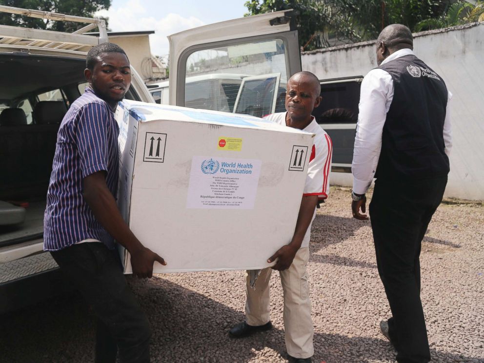 PHOTO: Congolese Health Ministry officials carry the first batch of experimental Ebola vaccines in Kinshasa, Democratic Republic of Congo, May 16, 2018.
