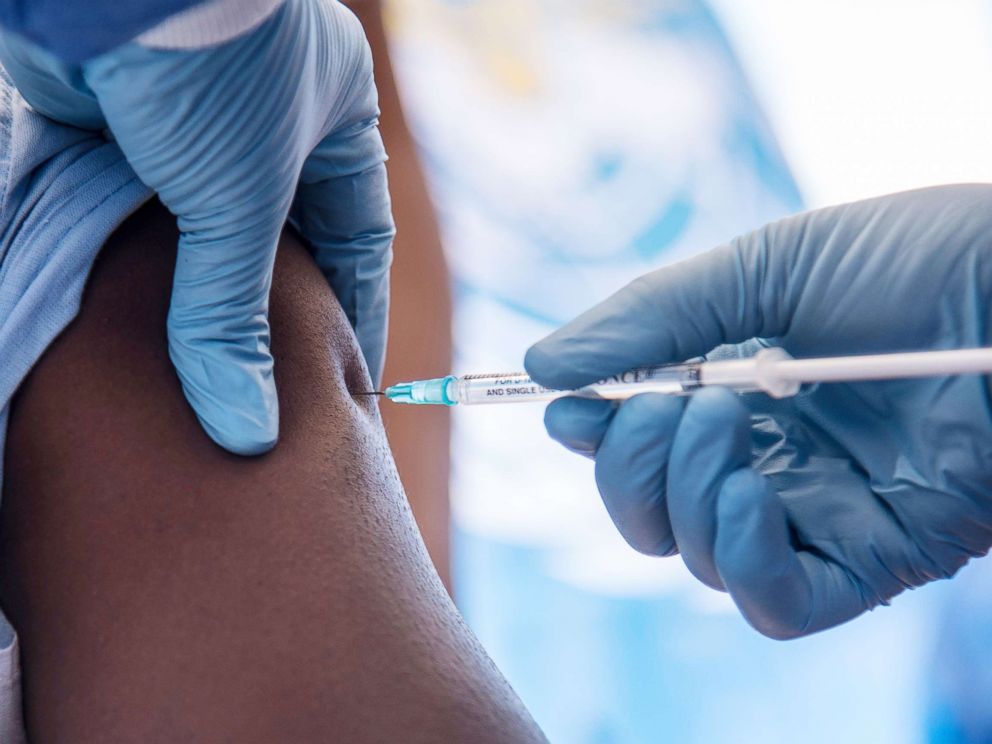 PHOTO: A worker from the World Health Organization administers Ebola vaccination during the launch of an experimental vaccine in Mbandaka, north-western Democratic Republic of the Congo, May 21, 2018.
