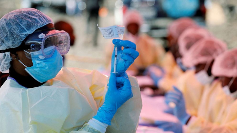 FILE PHOTO: A health worker fills a syringe with an Ebola vaccine before injecting it into a patient in Goma, Democratic Republic of Congo, Aug. 5, 2019.
