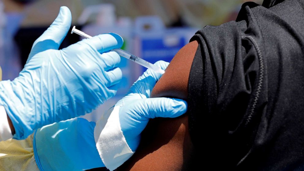 FILE PHOTO: A health worker injects a man with an Ebola vaccine in Goma, Democratic Republic of Congo, Aug. 5, 2019.