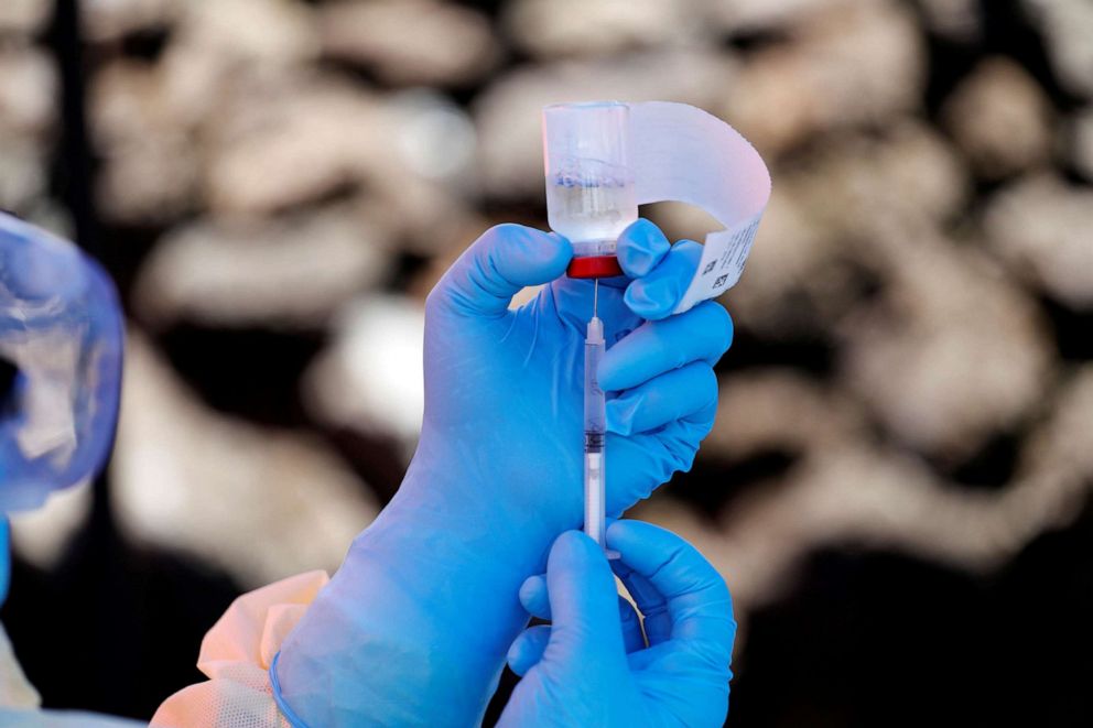 PHOTO: A health worker fills a syringe with Ebola vaccine before injecting it to a patient, in Goma, Democratic Republic of Congo, Aug. 5, 2019.