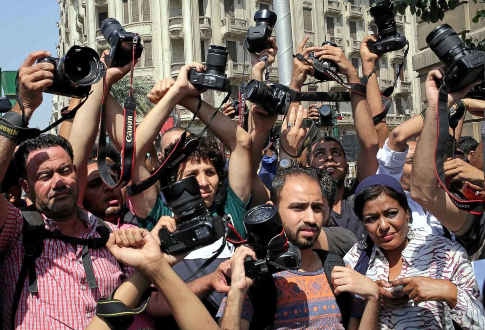 PHOTO: Egyptian journalists hold up their cameras outside the Egyptian Press Syndicate in downtown Cairo, Egypt, April 28, 2016.