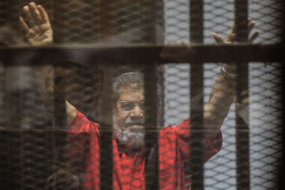 PHOTO: Ousted Egyptian President Mohammed Morsi gestures during a trial session on charges of espionage in Cairo, Egypt, June 18, 2016.