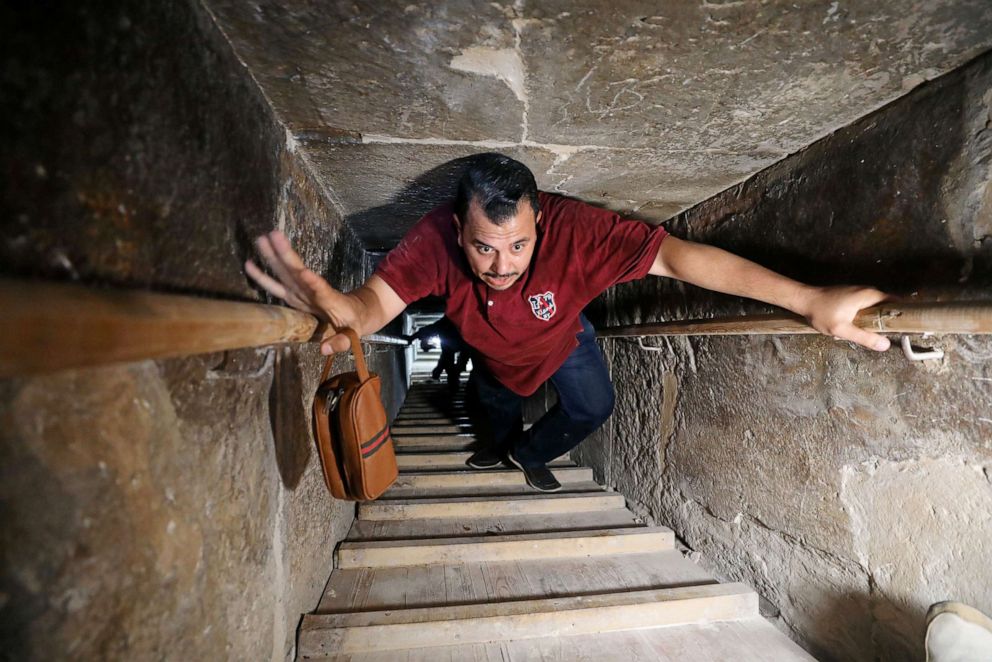 PHOTO: A man walks through a passage into the Bent Pyramid of Sneferu, that was reopened after restoration work, in Dahshur, south of Cairo, July 13, 2019.