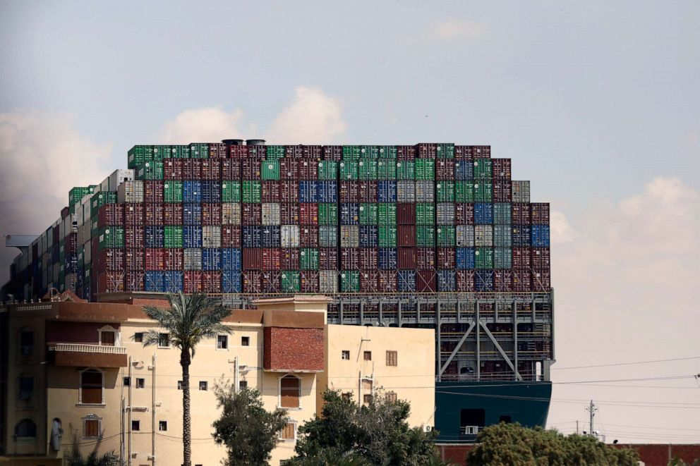 PHOTO: A Panama-flagged cargo ship, that is wedged across the Suez Canal and blocking traffic in the vital waterway is seen, March 26, 2021.