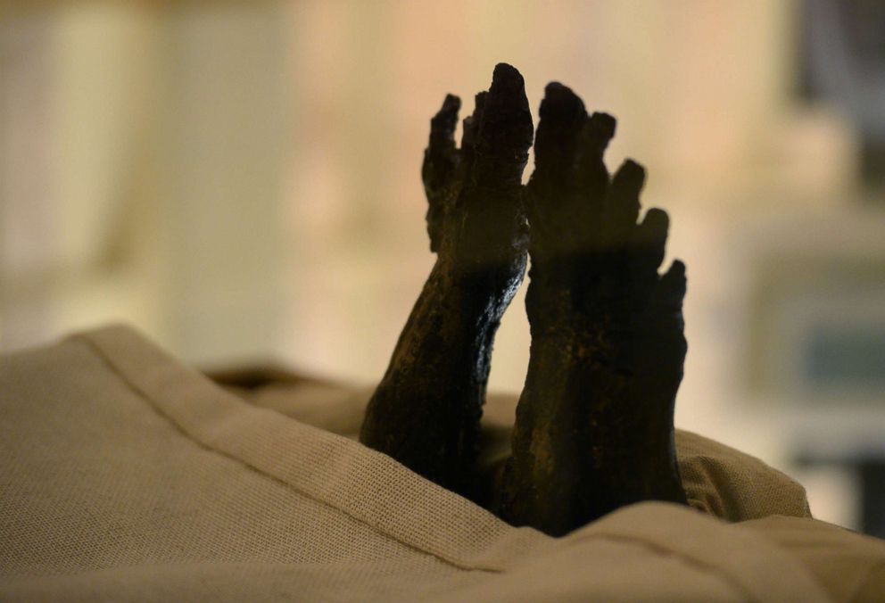 PHOTO: The feet of the linen-wrapped mummy of of the 18th dynasty Pharaoh Tutankhamun displayed in his climate-controlled glass case in his underground tomb in the Valley of the Kings on the west bank of the Nile river south of the capital Cairo.