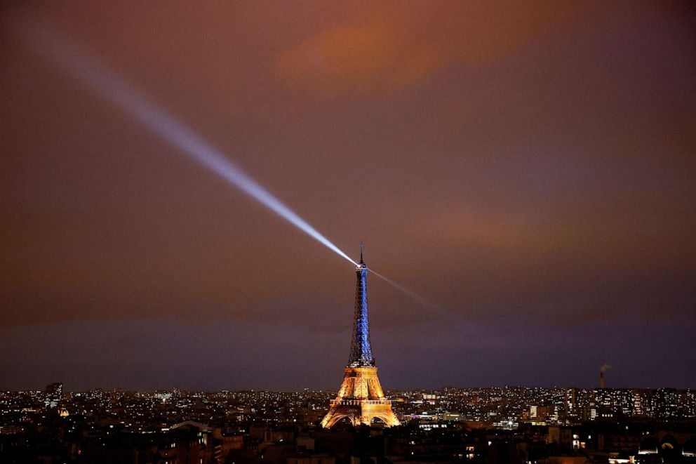 PHOTO: The Eiffel Tower is lit up in the national blue-and-yellow colors of Ukraine, to mark the first anniversary of Russia's invasion of Ukraine, in Paris, Feb. 23, 2023.