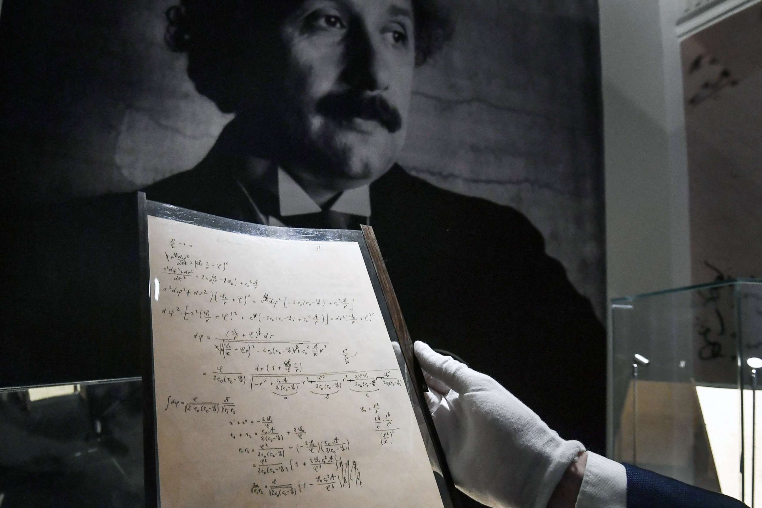 PHOTO: The preparatory manuscript to the theory of general relativity of Albert Einstein, during their presentation a day before being auctioned at Christie's auction house in Paris, Nov. 22, 2021.