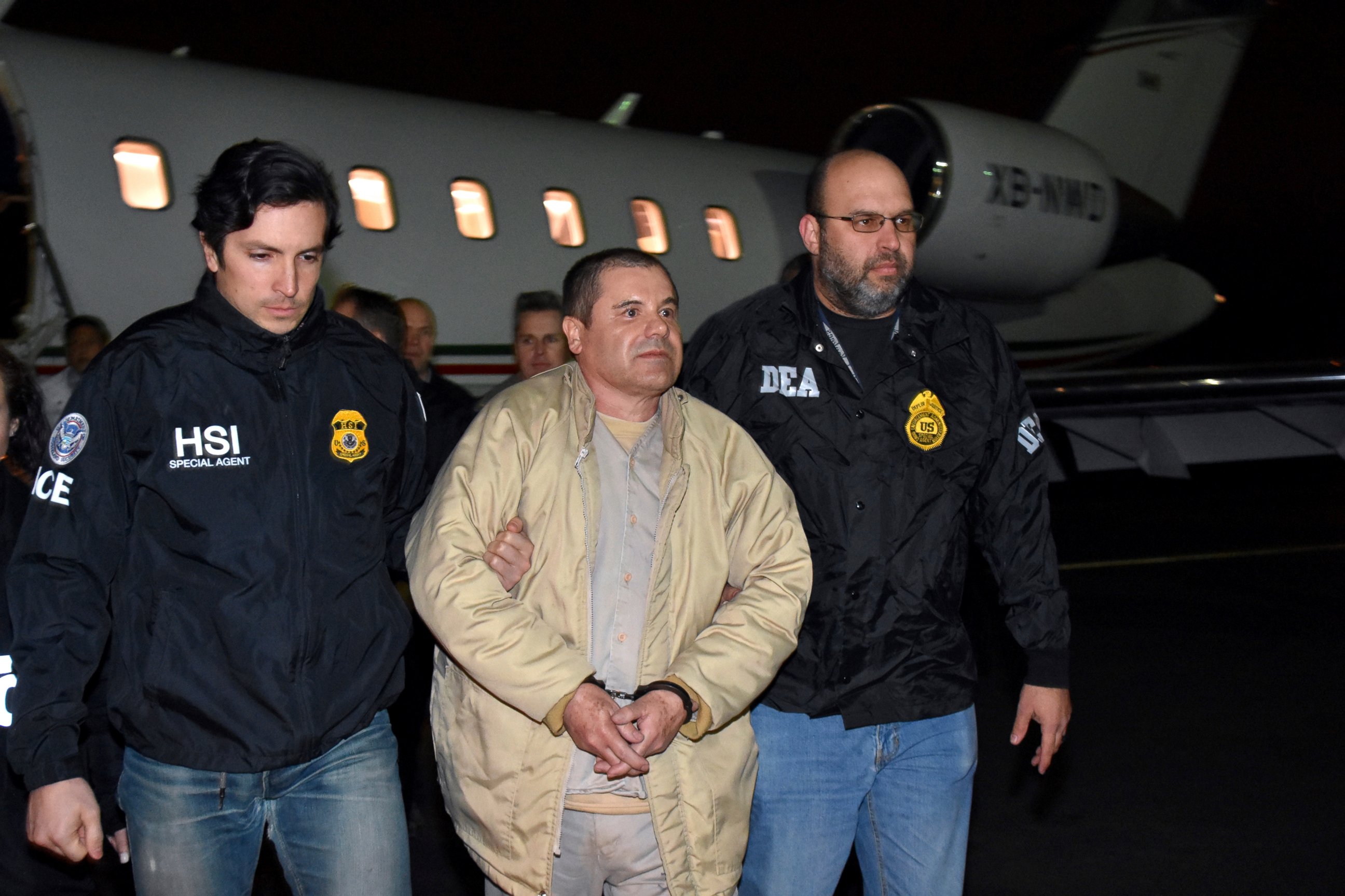 PHOTO: In this Jan. 19, 2017 file photo provided U.S. law enforcement, authorities escort Joaquin "El Chapo" Guzman, center, from a plane to a waiting caravan of SUVs at Long Island MacArthur Airport, in Ronkonkoma, N.Y.