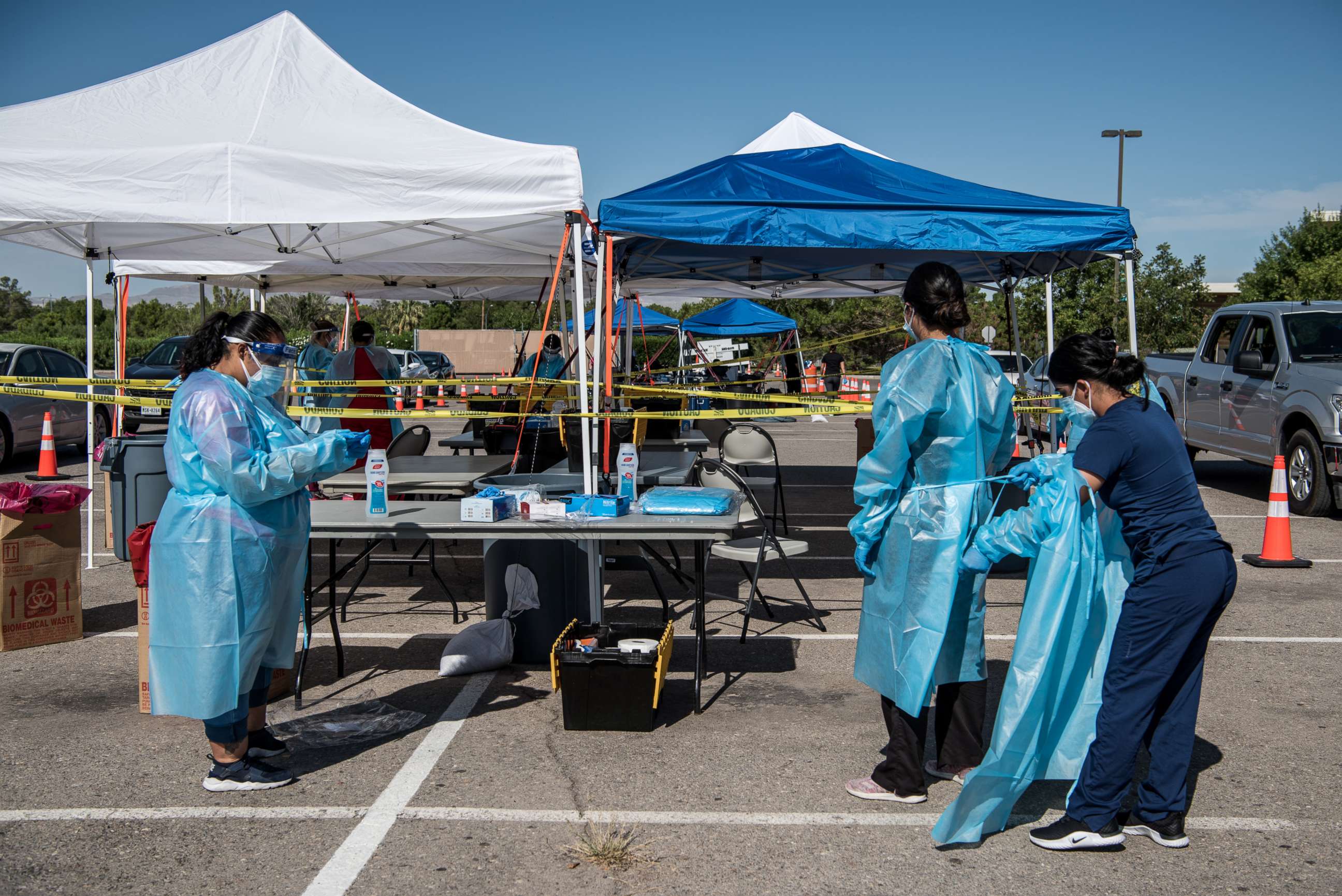 PHOTO: Nurses prepare themselves for coronavirus testing at a newly opened mega drive-thru testing site at El Paso Community College Valle Verde campus on July 21, 2020 in El Paso, Texas.