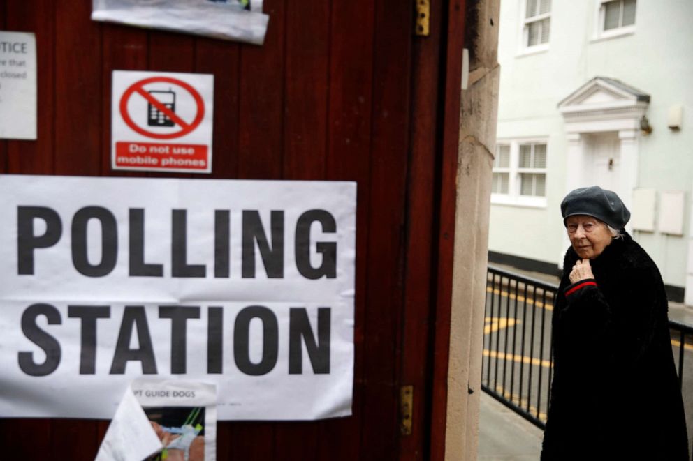 PHOTO: A woman arrives at a polling station in London, Dec. 12, 2019.