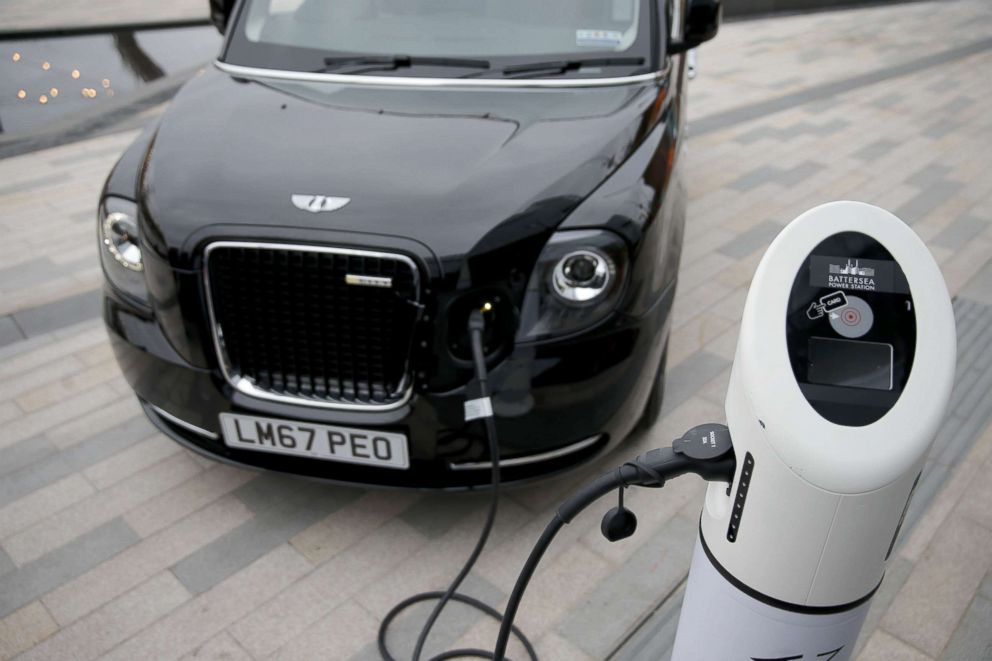 PHOTO: The new electric TX eCity taxi is connected to a sample electric vehicle charger at the Battersea power station in London on December 5, 2017.