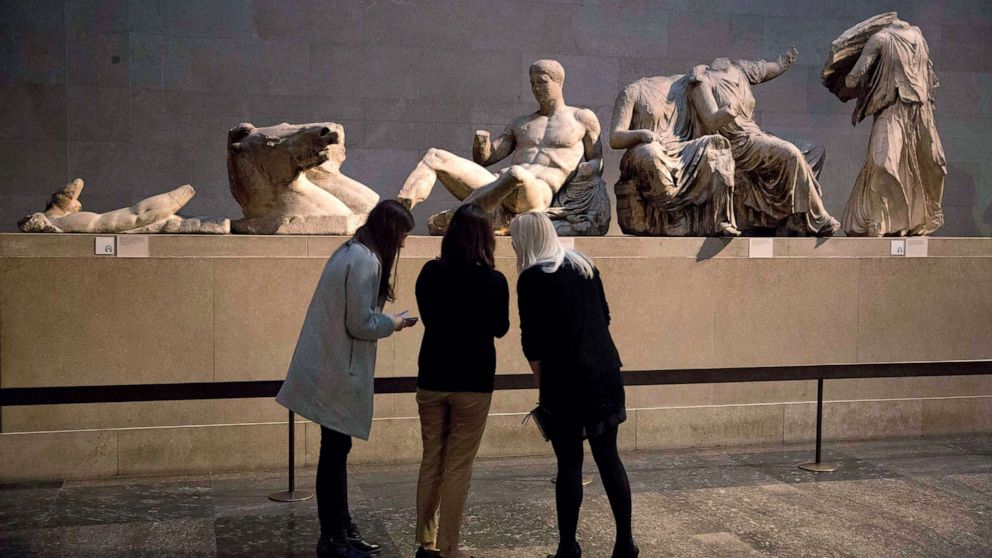 PHOTO: Visitors look at the marble statues from the east pediment of the Parthenon, on display at the British Museum in London, Jan. 8, 2015.