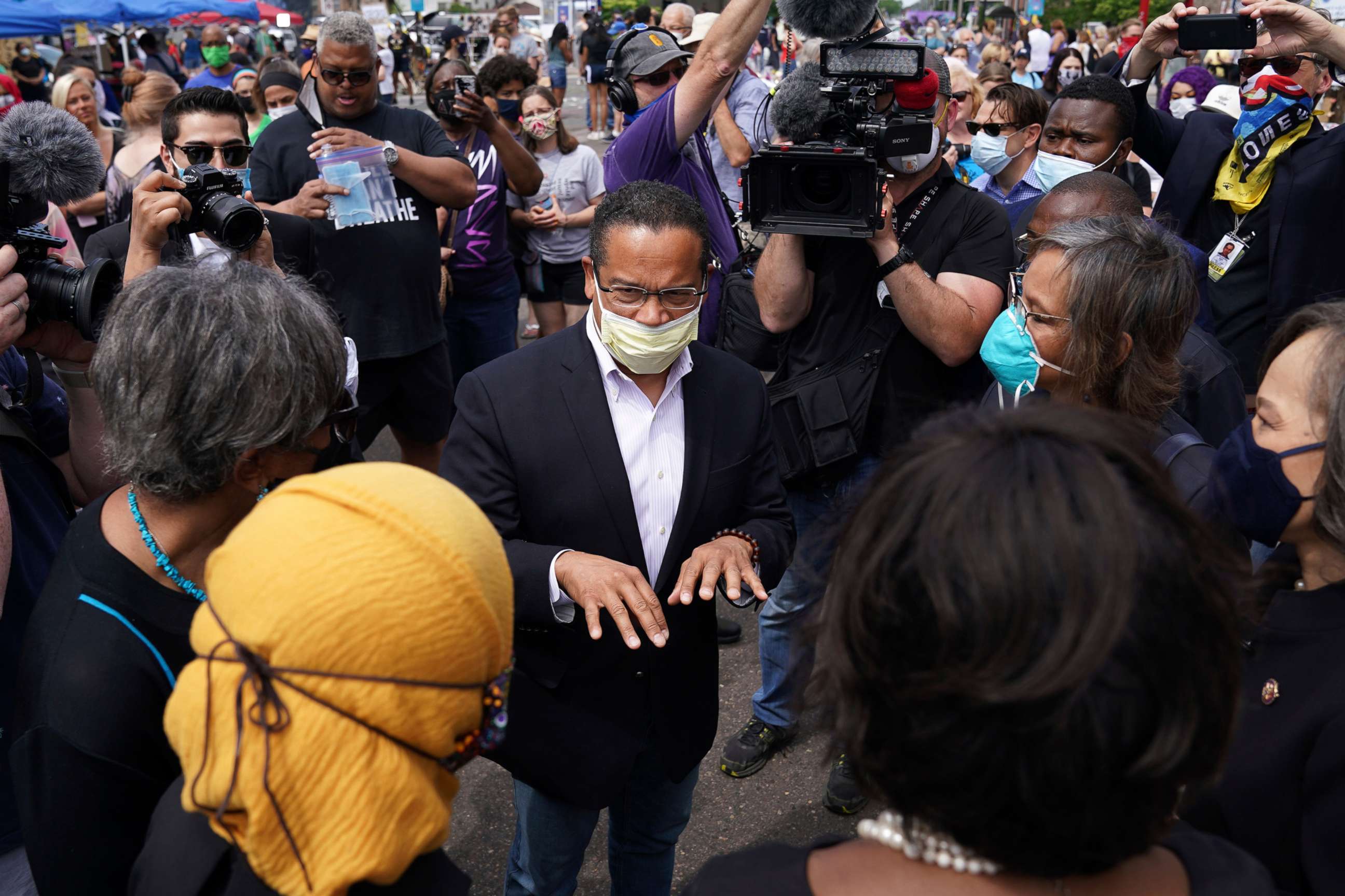 PHOTO: Sate Attorney General Keith Ellison speaks with Rep. Ilhan Omar and members of the United States Congressional Black Caucus as they visited the site of George Floyd's death, June 4, 2020 in south Minneapolis.