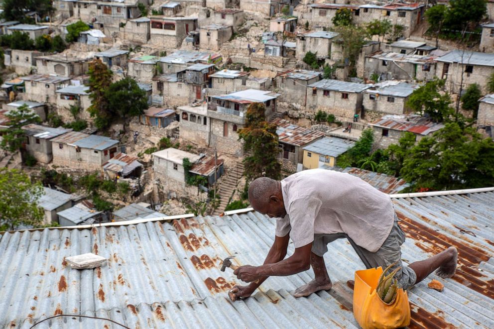 PHOTO: A man secures the roof of his house in response to Tropical Storm Elsa, in Port-au-Prince, Haiti, July 3, 2021.