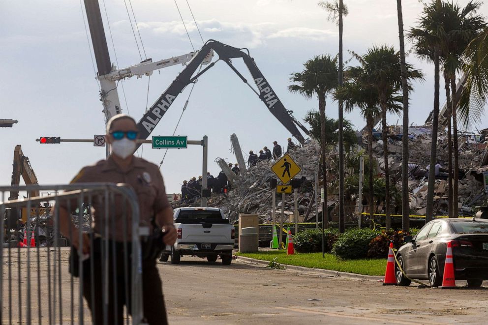 PHOTO: Rescue workers continue working on a pile of debris on July 5, 2021 after the partially collapsed Champlain Towers South condo was taken down in Surfside, Fla. The building was taken down due to possible impact of approaching Tropical Storm Elsa. 