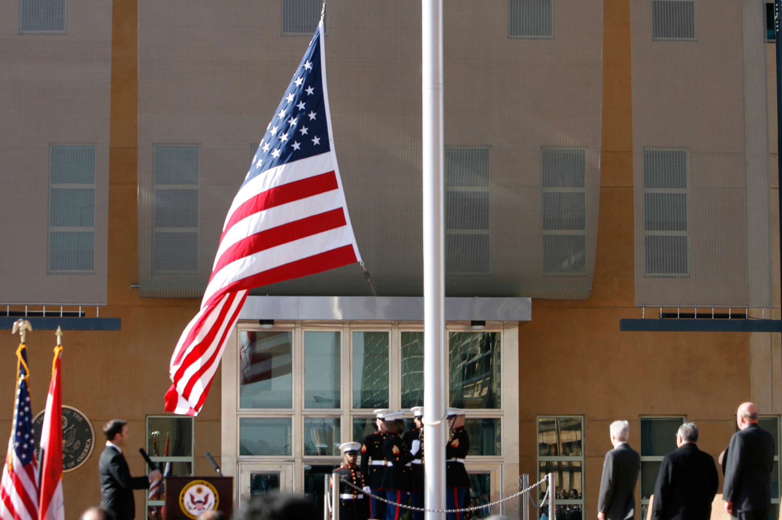 PHOTO: The US flag is raised during at the US embassy in the Green Zone, Jan. 5, 2009 in Baghdad, Iraq. 