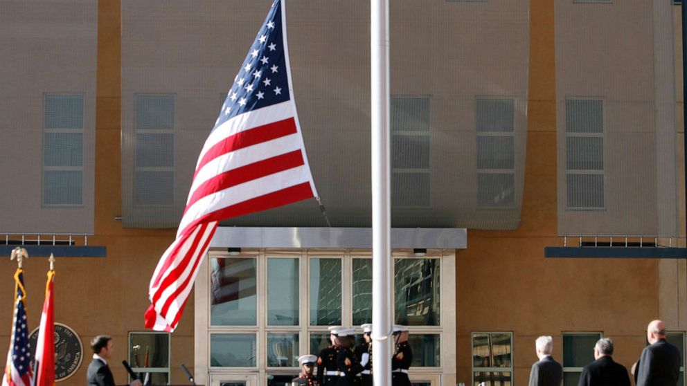 PHOTO: The US flag is raised during at the US embassy in the Green Zone, Jan. 5, 2009 in Baghdad, Iraq. 