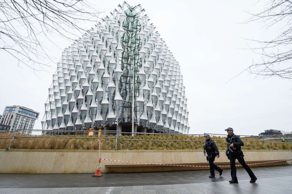 PHOTO: Armed police patrol outside the new U.S. Embassy as soldiers prepare to raise the American flag for the first time, Jan. 12, 2018 in London. 