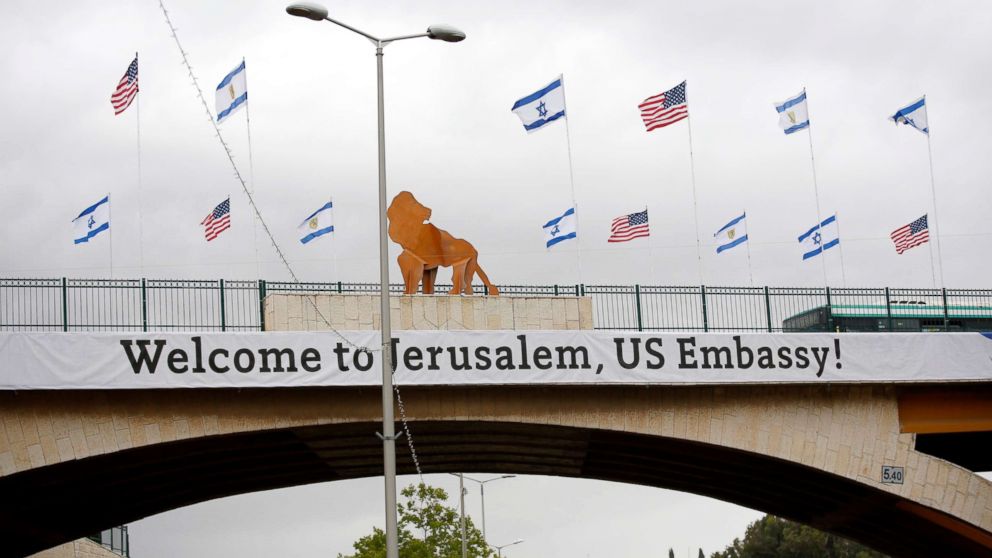 PHOTO: A sign and flags appear on a bridge nearby the US consulate that will act as the new US embassy in the Jewish neighborhood of Arnona, May 13, 2018.