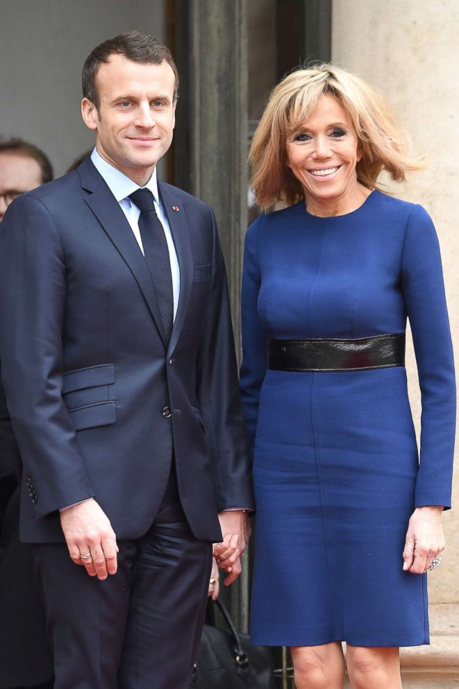 PHOTO: French President Emmanuel Macron and wife Brigitte Macron pose in the courtyard of Elysee Palace, March 19, 2018, in Paris.