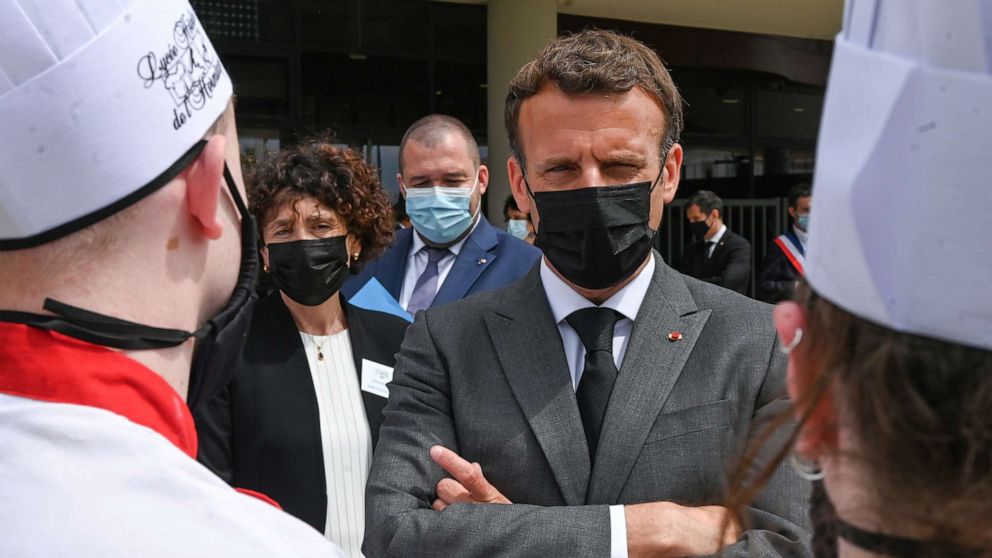 PHOTO: French President Emmanuel Macron talks with hospitality school students in Tain l'Hermitage, Drome department, France, June 8, 2021.