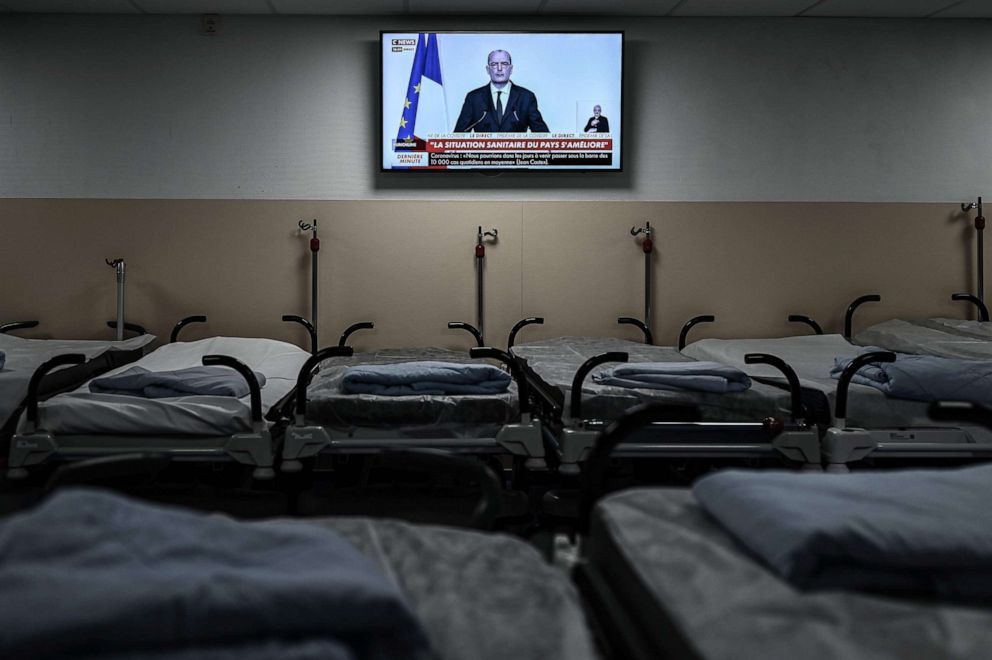PHOTO: This photograph taken on Dec. 3, 2020 shows empty beds at the Polyclinique Jean Villar private hospital in Bruges, southwestern France, as a television broadcasts a press conference with French Prime Minister Jean Castex.