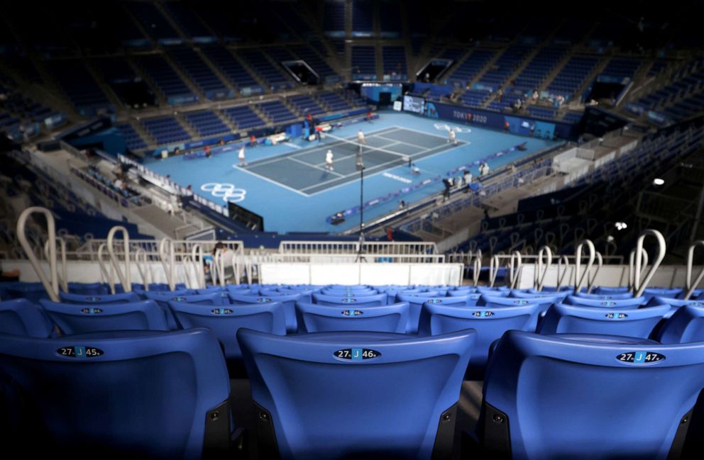 PHOTO: TOKYO, JAPAN - AUGUST 01:  A near empty stadium is witness as Andrey Rublev of Team ROC and Anastasia Pavlyuchenkova of Team ROC play Aslan Karatsev of Team ROC and Elena Vesnina of Team ROC in their Mixed Doubles Gold Medal match.