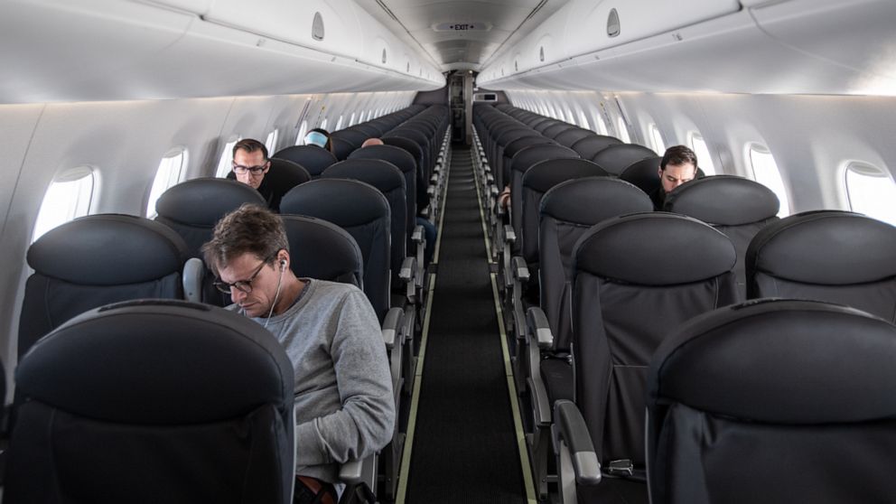 PHOTO: An almost empty British Airways passenger plane flies from Milan to London on March 5, 2020.