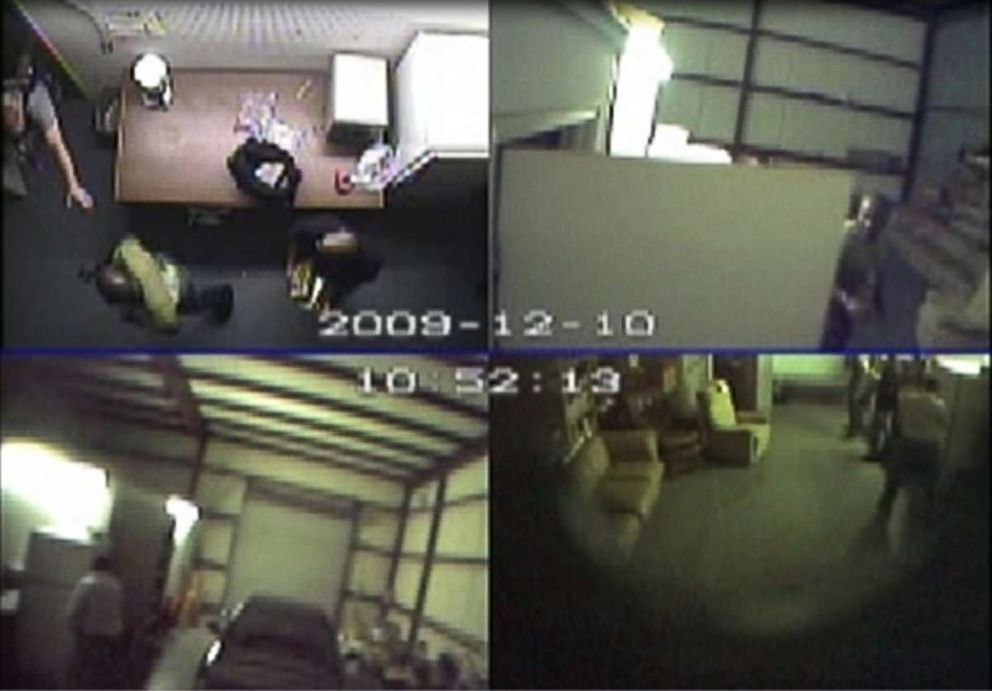 PHOTO: Surveillance video from Dec. 10, 2009, shows a police officer storming through a door inside the warehouse after James Mack tested the cocaine he had just been given.